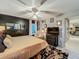 Comfortable bedroom with stylish decor, a ceiling fan, and ample natural light creating a serene and inviting space at 1131 Apple Ter, Leesburg, FL 34748