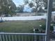 Expansive backyard featuring a well-maintained lawn and full fence at 11428 Pheasant Trl, Leesburg, FL 34788