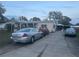 Wide driveway leads to a cozy home with ample parking space at 11428 Pheasant Trl, Leesburg, FL 34788
