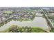 Aerial view of a residential community featuring homes around two tranquil lakes at 11579 Acosta Ave, Orlando, FL 32836