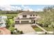 A stunning aerial view of the home and neighborhood located on the lake at 11579 Acosta Ave, Orlando, FL 32836