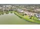 Aerial view of the home's premium lakeside lot, with a spacious backyard at 11579 Acosta Ave, Orlando, FL 32836