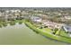 An aerial view of the home's premium lakeside lot, with a spacious backyard at 11579 Acosta Ave, Orlando, FL 32836