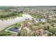 Beautiful community with a large lake, surrounded by lush greenery and well-maintained homes at 11579 Acosta Ave, Orlando, FL 32836