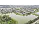 Beautiful aerial view of a lakeside community with well-maintained homes and lush landscaping at 11579 Acosta Ave, Orlando, FL 32836