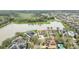 Stunning aerial shot of the home near the lake, beautifully situated within the community at 11579 Acosta Ave, Orlando, FL 32836