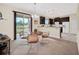 Breakfast nook features modern lighting, a round table and views of the lake at 11579 Acosta Ave, Orlando, FL 32836