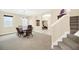 Traditional dining room features wood table with seating for six and gray carpet at 11579 Acosta Ave, Orlando, FL 32836