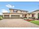 Charming two-story home with a three-car garage and a beautifully landscaped front yard at 11579 Acosta Ave, Orlando, FL 32836