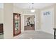 Spacious foyer with display cabinet, access to a flex room, and view of the front door at 11579 Acosta Ave, Orlando, FL 32836