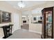 Elegant foyer with neutral tones, tile flooring, and view to formal areas at 11579 Acosta Ave, Orlando, FL 32836
