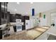 Kitchen features dark wood cabinets, stainless steel appliances, granite countertops, and bar seating at 11579 Acosta Ave, Orlando, FL 32836