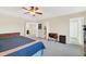 Bright, carpeted main bedroom with ample space and multiple windows at 11579 Acosta Ave, Orlando, FL 32836