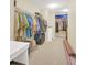 Spacious walk-in closet with ample shelving and hanging space for organized storage at 11579 Acosta Ave, Orlando, FL 32836
