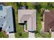 Birds eye view of house with a large yard, landscaping, and well maintained surrounding neighborhood at 12199 Se 175Th Loop, Summerfield, FL 34491