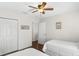 Comfortable bedroom with hardwood floors, ample closet space, and bright lighting at 12199 Se 175Th Loop, Summerfield, FL 34491