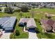 A well-maintained house with manicured lawn, landscaped walkway, and attached two-car garage at 12199 Se 175Th Loop, Summerfield, FL 34491
