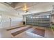 An expansive garage with finished walls, ceiling and a multi-panel garage door is ready for your vehicles at 12199 Se 175Th Loop, Summerfield, FL 34491