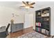 Well-organized office space with a ceiling fan, bookcase, and a gray storage cabinet at 12199 Se 175Th Loop, Summerfield, FL 34491