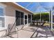 Covered screened-in patio offering an ideal space for outdoor relaxation and entertainment at 12199 Se 175Th Loop, Summerfield, FL 34491