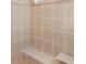 The tiled shower features a built in bench at 12199 Se 175Th Loop, Summerfield, FL 34491