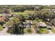 Aerial view of the home nestled among trees and surrounded by well-maintained lawns at 1301 N Shore Dr, Leesburg, FL 34748