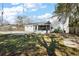 Lush backyard with well-maintained lawn leads to a screened-in patio and inground pool at 1301 N Shore Dr, Leesburg, FL 34748