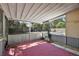 Enclosed patio reveals an outside view of a fenced yard, complete with an inground pool at 1301 N Shore Dr, Leesburg, FL 34748