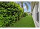 This lush backyard features manicured landscaping and a pristine lawn at 1367 Honea Path, The Villages, FL 32162