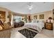 Bedroom featuring a large window, desk, and comfortable furnishings at 1367 Honea Path, The Villages, FL 32162