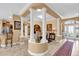 Open concept dining room featuring a large table, decorative pillars and tiled floor at 1367 Honea Path, The Villages, FL 32162