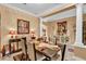Formal dining area featuring a table set for six, neutral walls and decorative lighting at 1367 Honea Path, The Villages, FL 32162