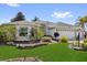 Beautiful single-story home with a 3 car garage, lush landscaping, and attractive architectural details at 1367 Honea Path, The Villages, FL 32162