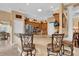 Kitchen with breakfast bar, stainless steel appliances and a full view of the eating area at 1367 Honea Path, The Villages, FL 32162