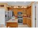 Kitchen showcasing stainless appliances, custom wood cabinets, and decorative countertop at 1367 Honea Path, The Villages, FL 32162