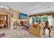 Cozy living room with a large window, comfortable seating, and tiled floor at 1367 Honea Path, The Villages, FL 32162