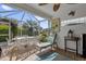 This screened lanai includes dining and lounge furniture, perfect for relaxing outdoors at 1367 Honea Path, The Villages, FL 32162