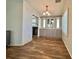 Inviting dining area with stylish cabinets and modern lighting, seamlessly connected to the kitchen for easy entertaining at 137 Hibiscus Way, Leesburg, FL 34748