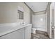 Clean bathroom features a white vanity, mirror, and shower-tub combo at 147 Woodstork Way, Frostproof, FL 33843