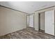 Bedroom features wood-look flooring and access to a closet at 147 Woodstork Way, Frostproof, FL 33843