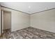 Bedroom featuring wood-look flooring and access to other rooms at 147 Woodstork Way, Frostproof, FL 33843
