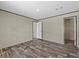 Bedroom with wood-look flooring and large closet at 147 Woodstork Way, Frostproof, FL 33843