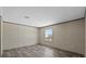 Cozy bedroom with a window bringing in natural light, plus modern floors at 147 Woodstork Way, Frostproof, FL 33843