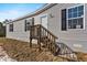 Close-up of the front of the new construction home with small front porch at 147 Woodstork Way, Frostproof, FL 33843