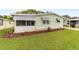 A close exterior view showcasing manicured landscaping surrounding this lovely home at 1507 E Schwartz Blvd, Lady Lake, FL 32159