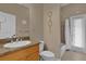 This is a clean bathroom with granite counters, a shower and tub combination, and neutral paint at 1602 Oak Hollow Rd, Clermont, FL 34711