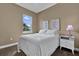 Comfortable bedroom featuring a bright window, carpet floors, and neutral color palette at 1602 Oak Hollow Rd, Clermont, FL 34711