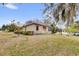 Charming single-story home featuring a well-maintained lawn and mature landscaping in a serene neighborhood at 1602 Oak Hollow Rd, Clermont, FL 34711