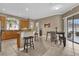 Well-lit kitchen featuring a breakfast bar, stainless steel appliances, and tile flooring at 1602 Oak Hollow Rd, Clermont, FL 34711