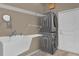 Modern laundry room with stacked washer and dryer and ample shelving at 1602 Oak Hollow Rd, Clermont, FL 34711